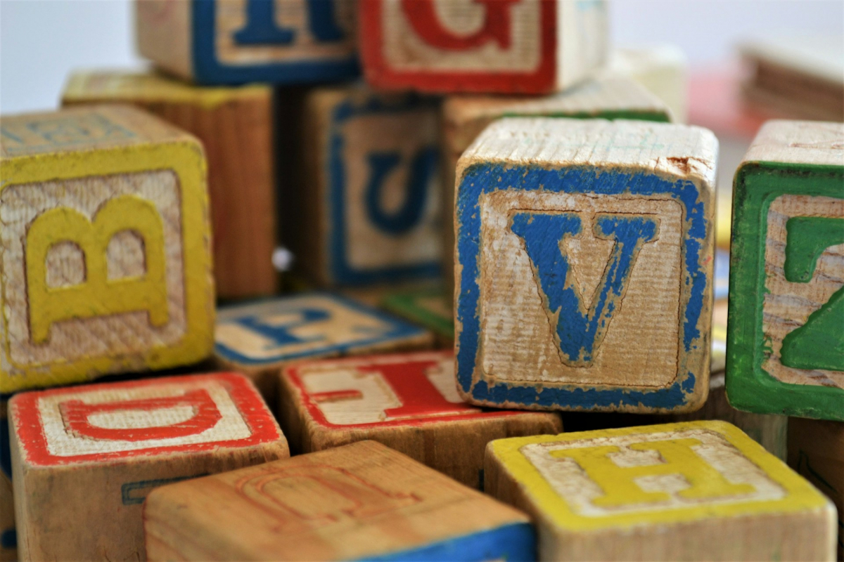 wooden block letter V
